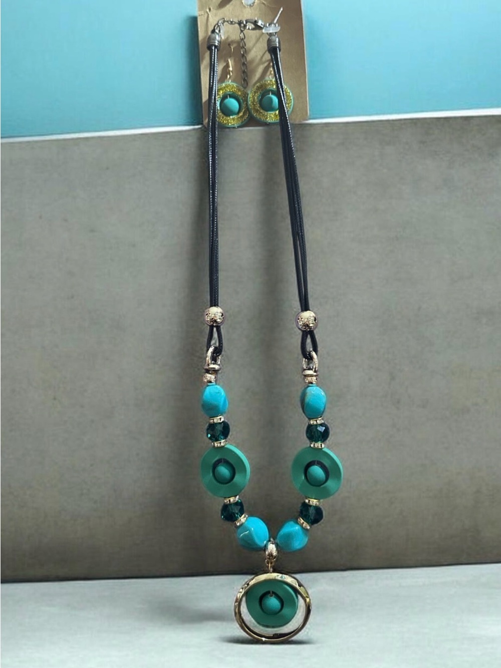 Turquoise Circle Pendant Necklace and earring set with Gold Accents 
1581
